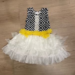Giggle Moon black and white ruffle dress with yellow waist detail